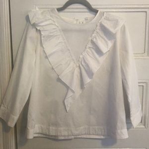 White ruffled blouse